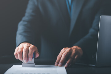 Businessman validates and manages business documents and agreements, signing a business contract...