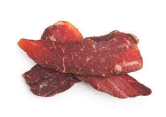 Pieces of delicious beef jerky on white background, top view