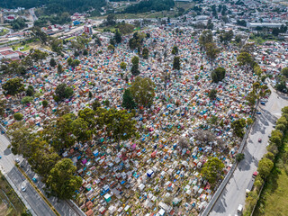 Aerial view of a very colorful cemetery in the mountains. Sunset. Panorama.
