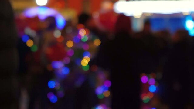 Abstract blurred christmas lights bokeh background. The flashing lights of the Christmas tree flicker. Winter holidays concept.