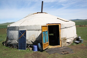 A nomadic tent (ger) in the serenity of the lonely Bulgan valley, Mongolia. The nomadic family lives alone with their livestock in the huge valley. They move out to other steppes for 4-5 times a year.