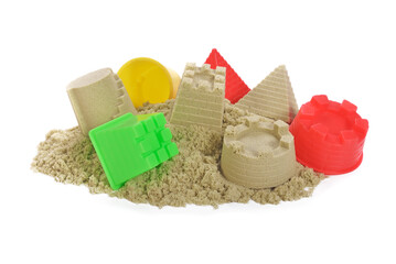 Sand Castles of kinetic sand and toys isolated on white background.