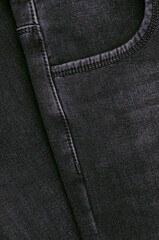 Part of dark jeans.