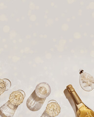New Year holiday flat lay, white sparkling wine in different crystal glasses, festive champagne...