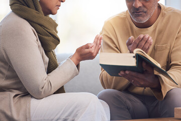 Worship, prayer and Muslim couple with a quran, reading and studying spiritual faith in their...
