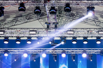 spotlights on outdoor concert stage with light beams. light beam at outdoor stage.