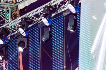 row spotlights illuminate outdoor stage at a concert. stage concert lights.