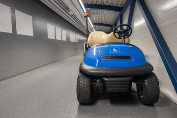 The electric car is parked in the corridor of the airport