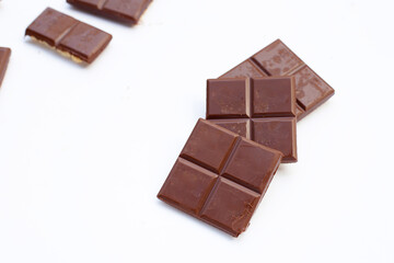 Square biscuits in dark chocolate