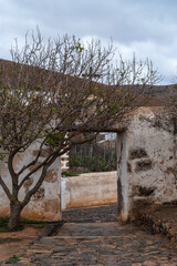 Convent Betancuria with historical door and sidewalk, Fuerteventura