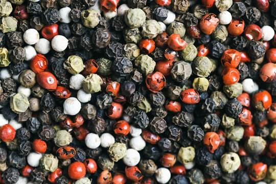 black red white green and allspice mix peppercorn background