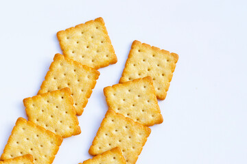 Dry cracker cookies on white background.