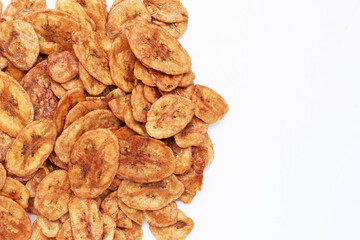 Banana chips on white background