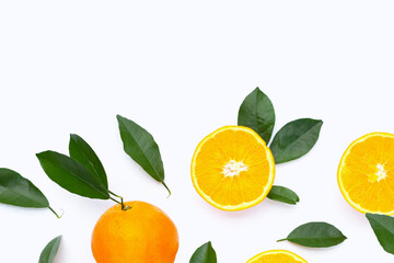 Orange fruit with green leaves on white background.