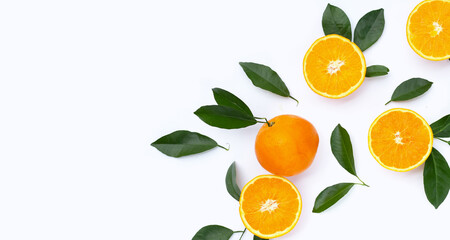 Orange fruit with green leaves on white background.