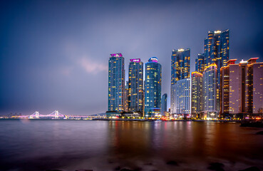 Obraz premium Busan, Korea - April 25, 2015: Marine city is a luxury and prestigious residential area constructed on Suyeong bay reclaimed land in Haeundae District.
