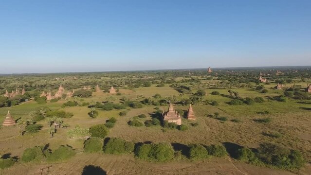 Aerial view amazing famous travel and landscape scene of ancient temples and carriages at sunset in Bagan, Myanmar. Top best destinations in Asia.