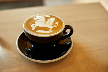 Selective focus cup of hot latte art coffee