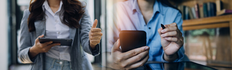 Businessman and team analyzing financial statement Finance task. with smart phone and laptop and tablet. Wealth management concept
