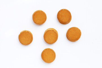 Custard cream sandwich biscuits on white background.