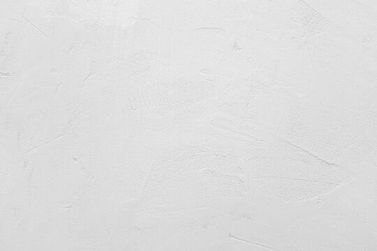 White cement or stone wall background and rough textured