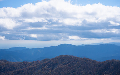 Mountain views and blue sky seen from near the top of Mt. Kenzan in Japan