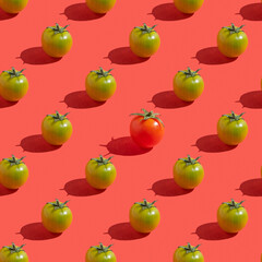 Seamless pattern with fresh cherry tomatoes on red background.