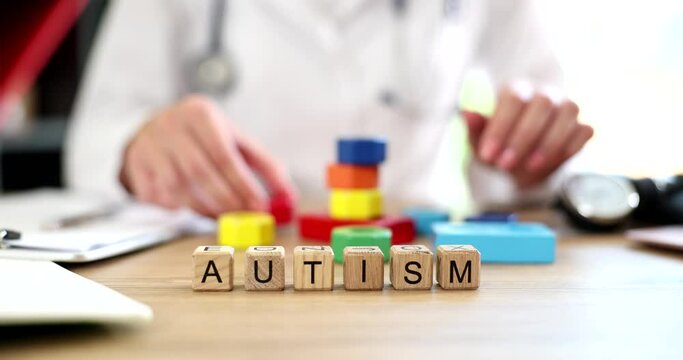 Childhood illness concept colorful cubes text autism