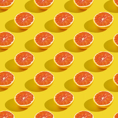 Seamless pattern with half of red orange on yellow background.