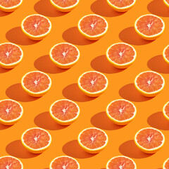 Seamless pattern with half of red orange on yellow background.