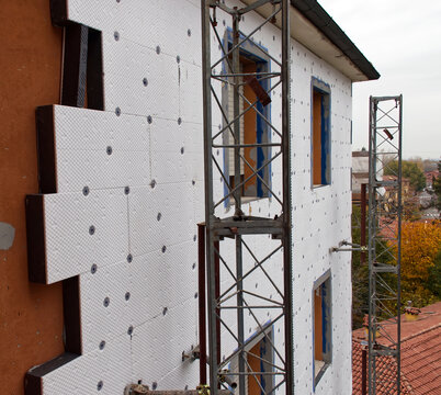 Building site for construction of external thermal insulation. Energy saving concept. Bologna, Italy