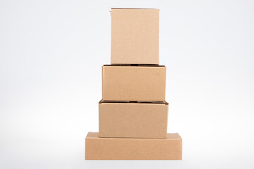 stack of pyramid four cardboard boxes of different sizes on white background