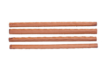 Top view of chocolate wafer rolls isolated on white
