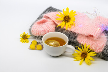 Obraz na płótnie Canvas herbal healthy drinks hot honey lemon and lozenge for health care sore throat with flowers sunflower arrangement flat lay style on background white