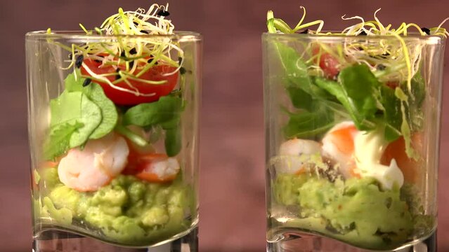 Avocado, shrimp, arugula, mayonaise, espelette pepper and lemon, leek sprouts recipe. High quality 4K video