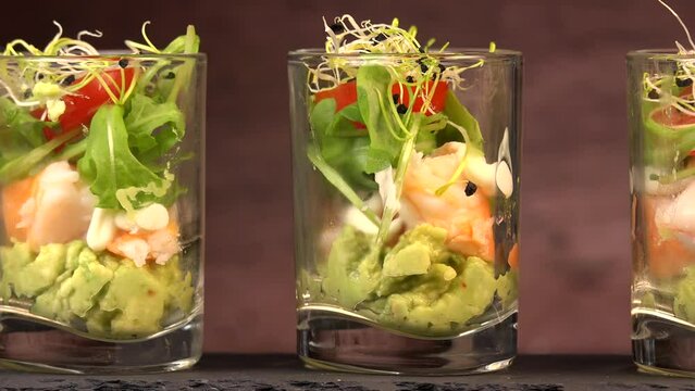 Avocado, shrimp, arugula, mayonaise, espelette pepper and lemon, leek sprouts recipe. High quality 4K video