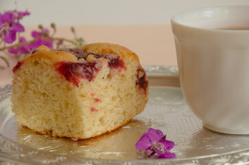 a cup of tea and a piece of cupcake. herbal tea with dessert