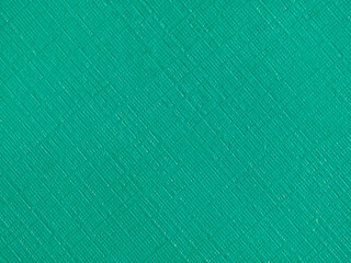 Green-turquoise textured cardboard background. Green-blue cardboard as a background texture