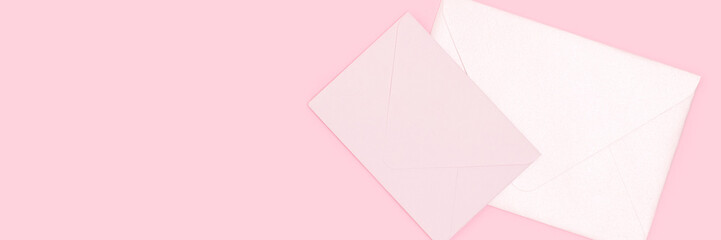 Banner with envelopes on a pink background. Minimal concept with place for text.