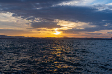 Amazing sunrise view with natural clouds. Morning sun with beautiful colors