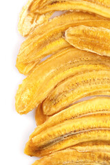 Dried banana slices. Sliced dried banana isolated on white background. Sun-dried fruit. close up
