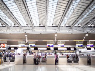 Fototapeta premium BANGKOK, THAILAND - May 3, 2019: inside of Suvarnabhumi Airport. Airport Check-In Counters With Passengers in Bangkok ,Thailand.This airport is handling about 55 million passengers annually.
