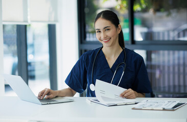 Asian Young female doctor on modern clinic background. healthcare and medical concept.