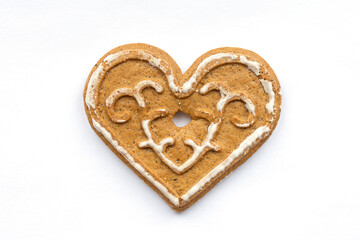 Christmas gingerbread in the shape of a heart on a white background