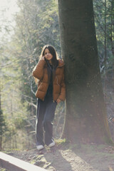 A teenage girl on a walk in the forest in the Ukrainian Carpathians.