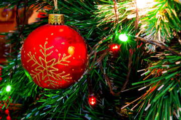 Colorful decorations and ornaments hanging on the Christmas tree