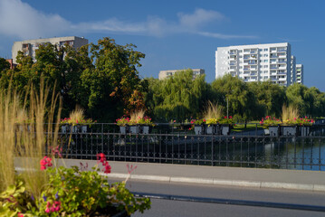 CITYSCAPE - Bridge and landscape of a green city on the banks of the river