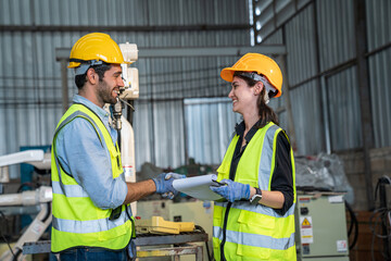 Portrait of female automation engineer team standing and working in industrial factory. 