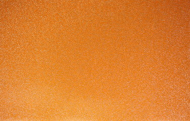 Naklejka premium Golden wall with abstract spots as a background. Beautiful golden texture with patterns, decorative plaster. Modern bright wall painting in trendy shades, unusual spotted yellow and gold surface.
