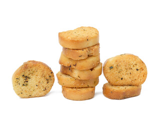 A pile of round bread croutons with spices on a white isolated background. Snack